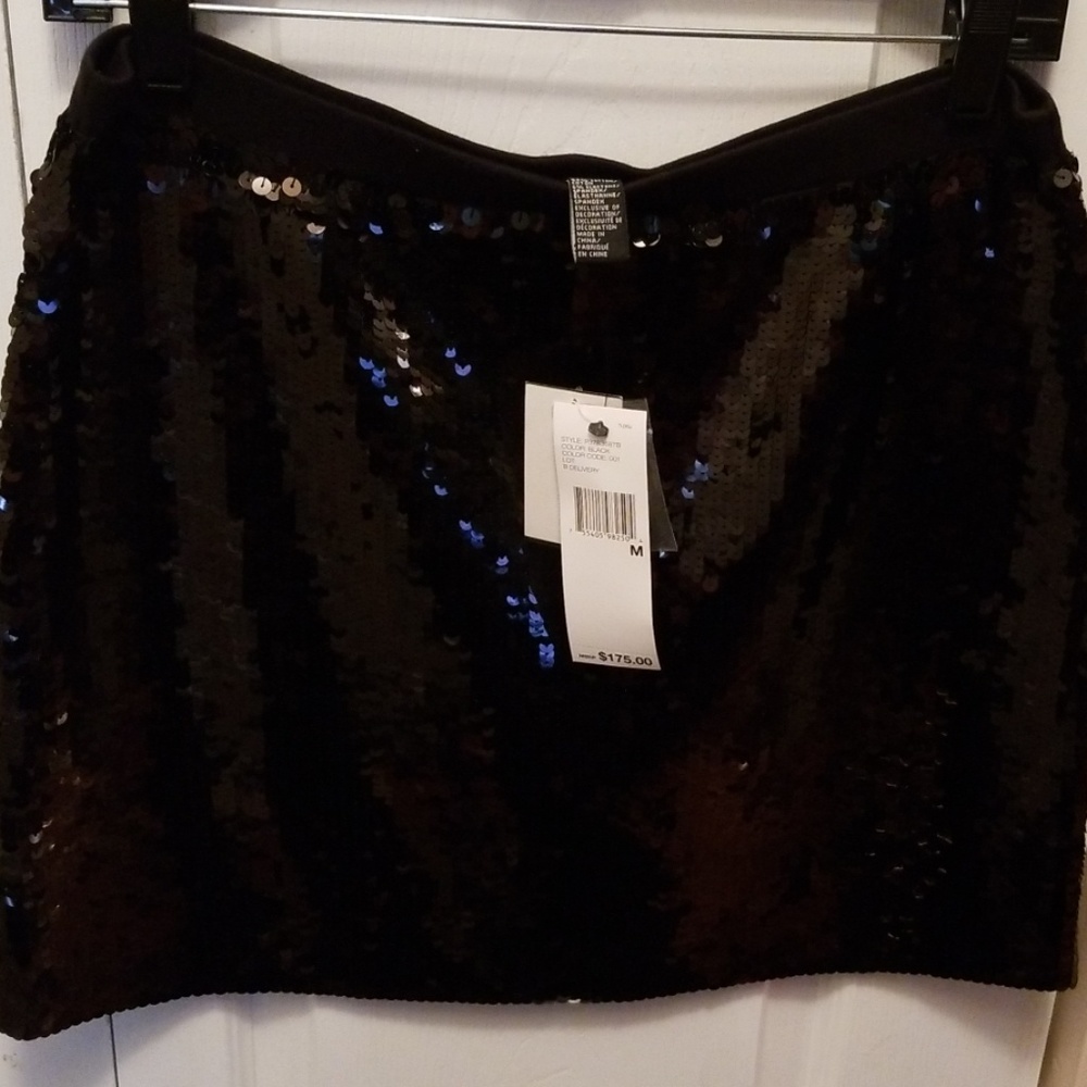 Black designer sequin mini skirt unworn.  Size M